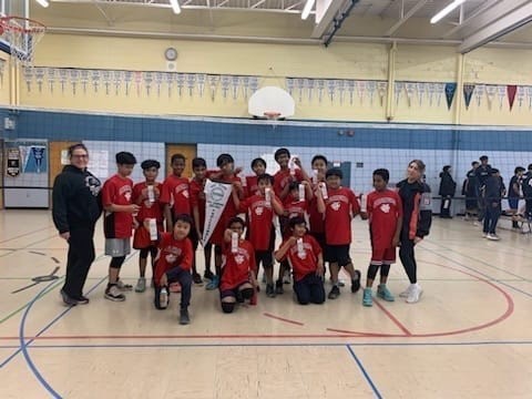 Photo of the St. Lawrence boys sports team holding up their ribbons Photo of the St. Lawrence boys sports team holding up their ribbons