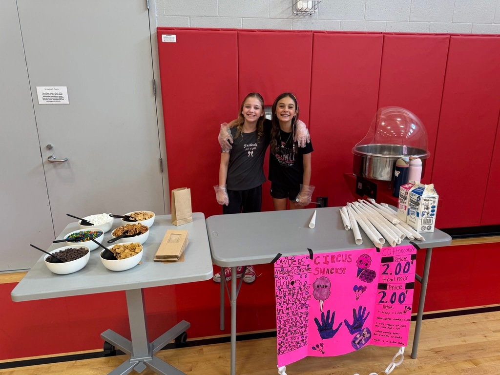 Two students running a booth for Market Day.