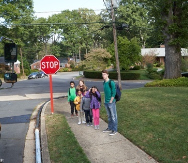 Students waiting at a bus stop