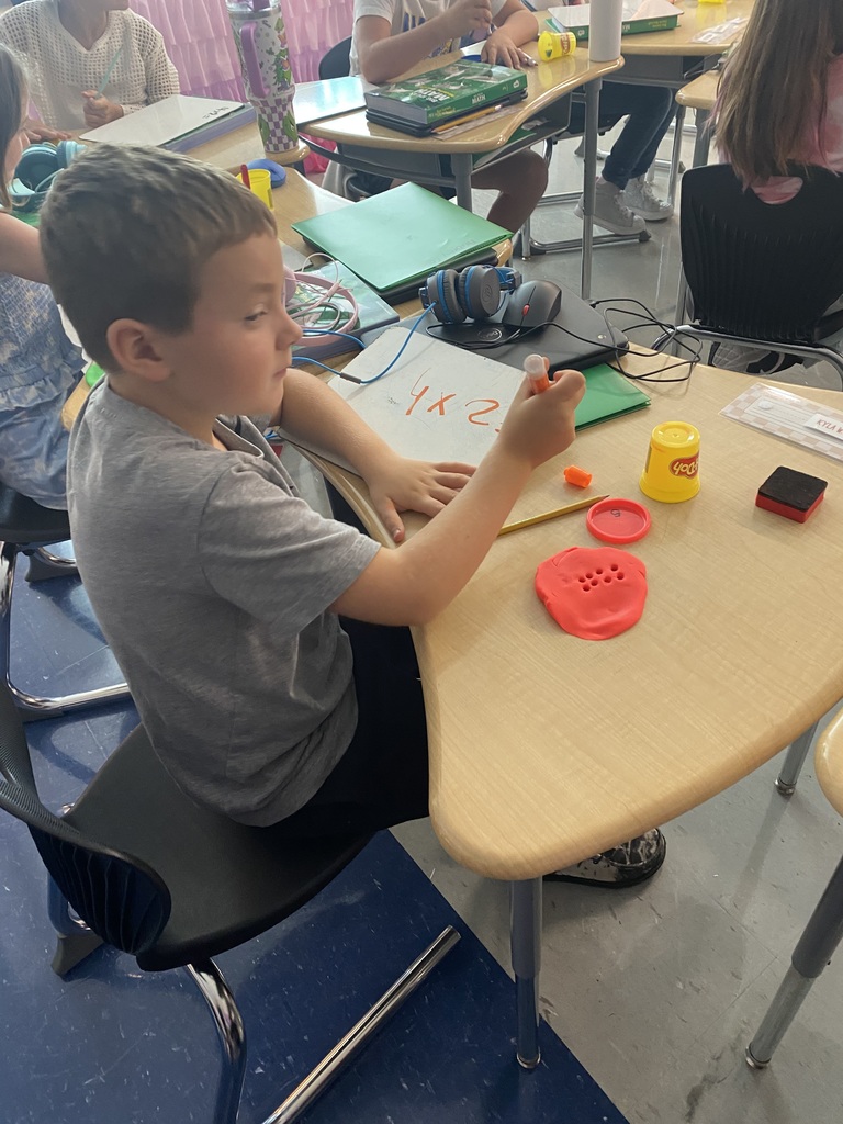 Students playing with play-doh