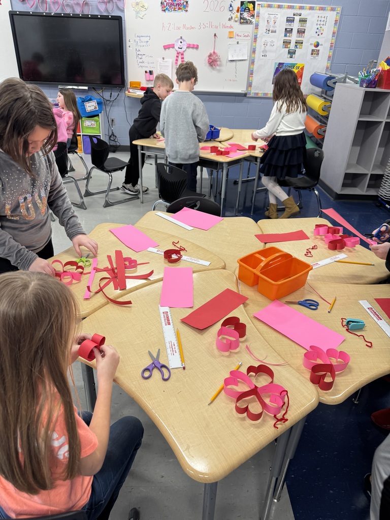 students creating heart wreaths 