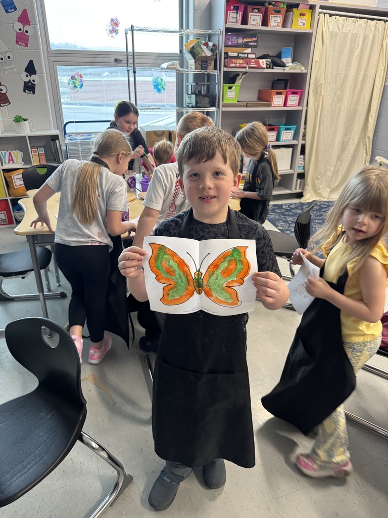 Student holding butterfly 