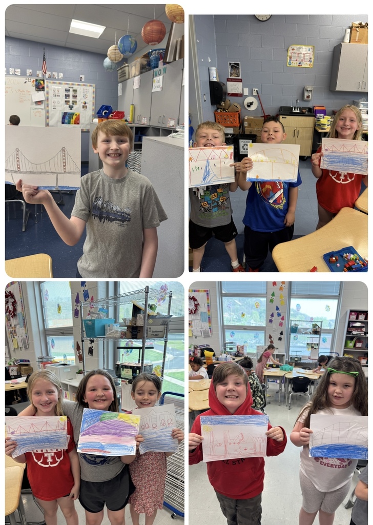 students holding their bridge illustrations 