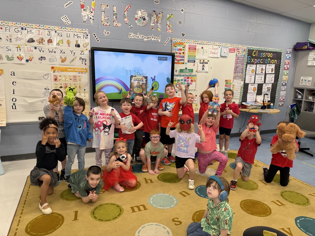 Students were able to bring toys from home to school and are pictured with their toys.