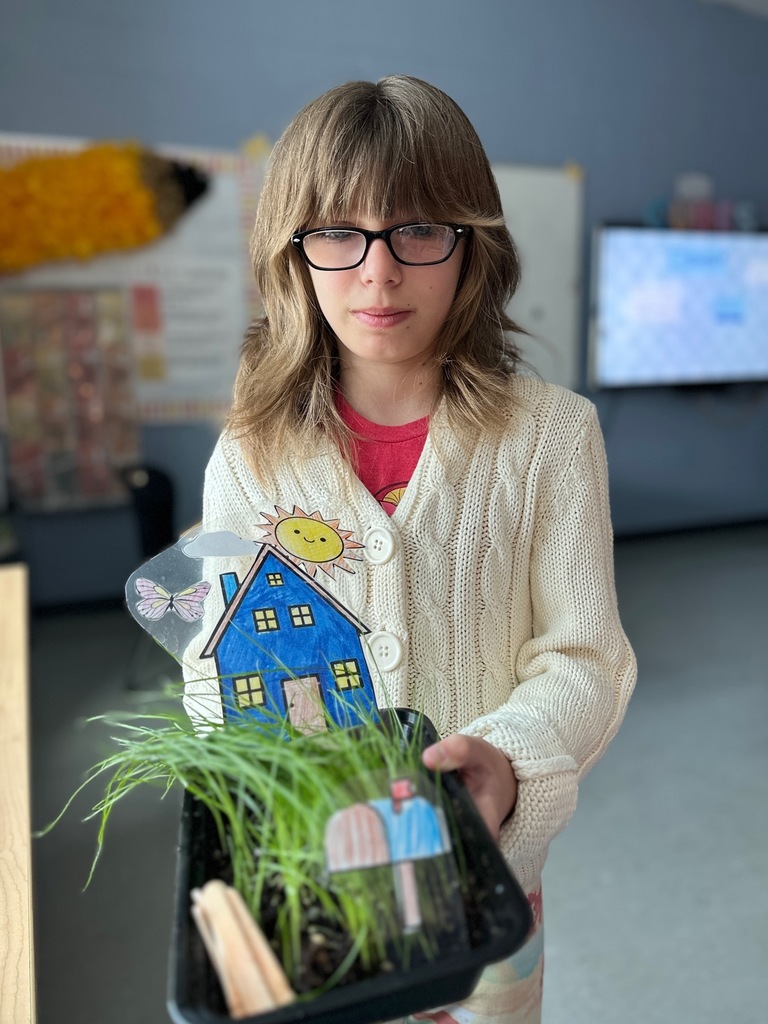 kid(s) with grass plant