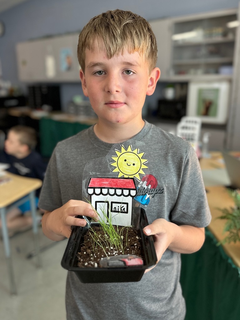 kid(s) with grass plant