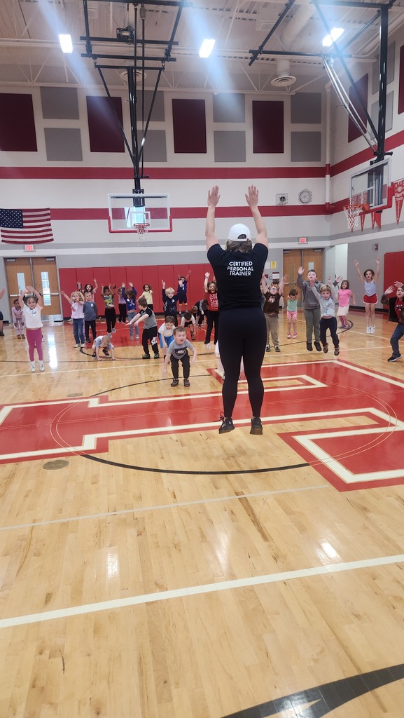 Students with guest career speaker. Speaker is leading them in exercises.