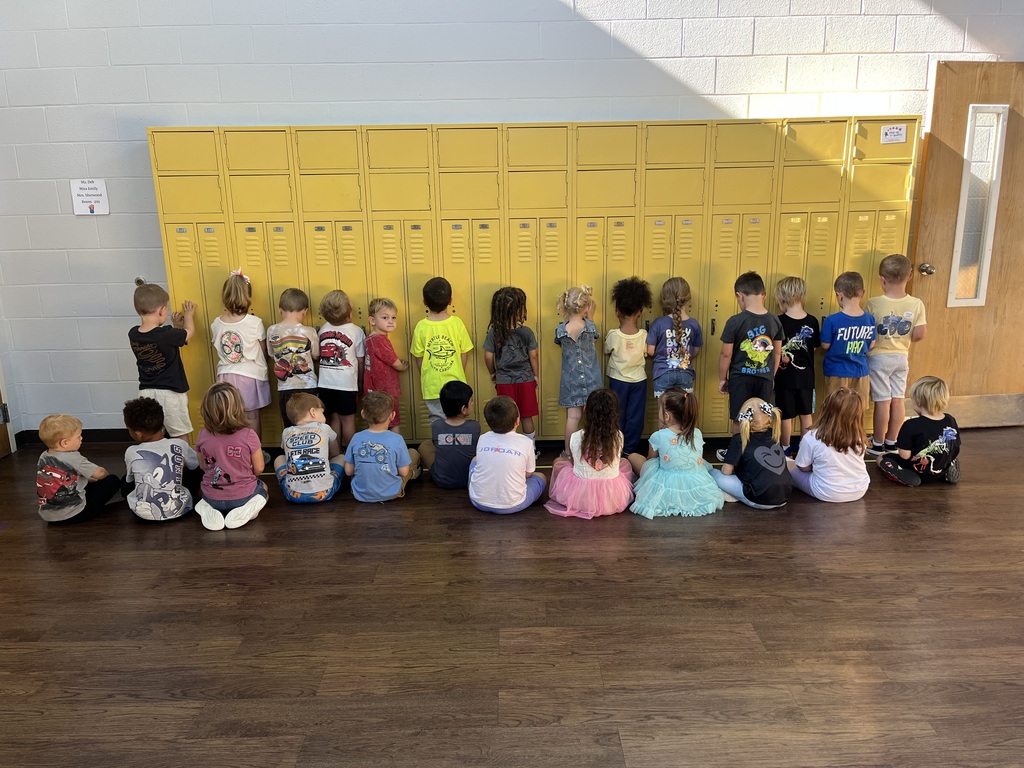 Toronto preschool students celebrate Backwards Day during Attendance Spirit Week. In the photos, students pose together showing both the fronts and backs of their outfits, with many wearing their shirts backwards for the special theme day. A smaller group of preschoolers also smiles together in their classroom while showing off their Backwards Day outfits.