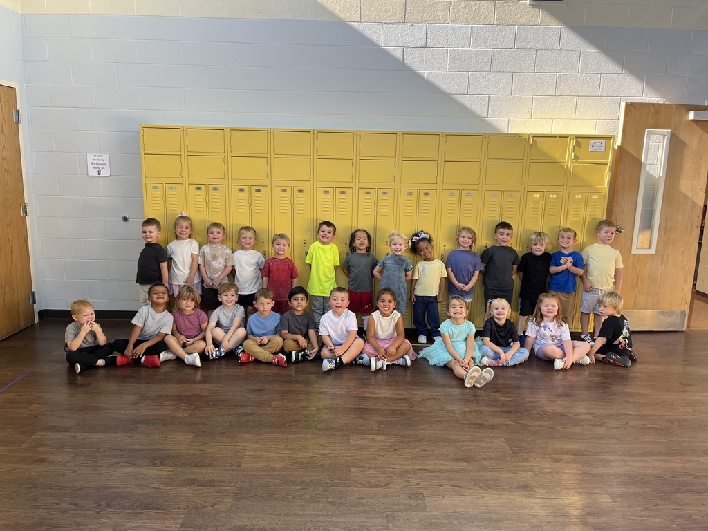 Toronto preschool students celebrate Backwards Day during Attendance Spirit Week. In the photos, students pose together showing both the fronts and backs of their outfits, with many wearing their shirts backwards for the special theme day. A smaller group of preschoolers also smiles together in their classroom while showing off their Backwards Day outfits.