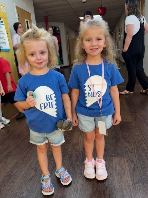 Toronto preschool students celebrate Twin Day during Attendance Spirit Week. In several photos, pairs and groups of students smile and pose together wearing matching or coordinated outfits, including checkered clothing, matching character shirts, colorful dresses, and matching friendship shirts.