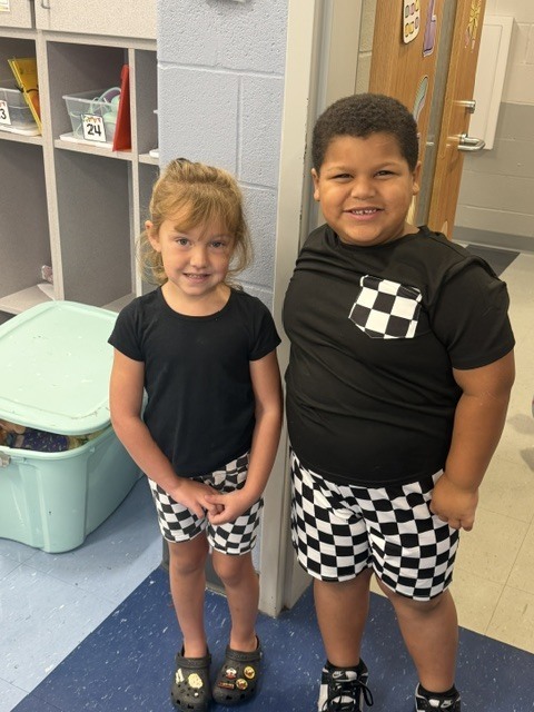 Toronto preschool students celebrate Twin Day during Attendance Spirit Week. In several photos, pairs and groups of students smile and pose together wearing matching or coordinated outfits, including checkered clothing, matching character shirts, colorful dresses, and matching friendship shirts.