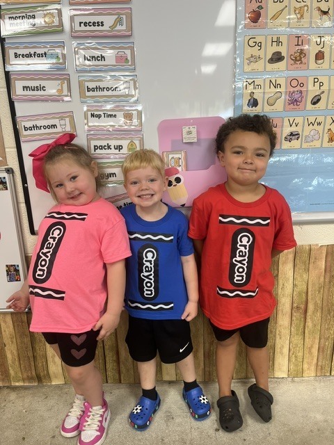 Toronto preschool students celebrate Twin Day during Attendance Spirit Week. In several photos, pairs and groups of students smile and pose together wearing matching or coordinated outfits, including checkered clothing, matching character shirts, colorful dresses, and matching friendship shirts.