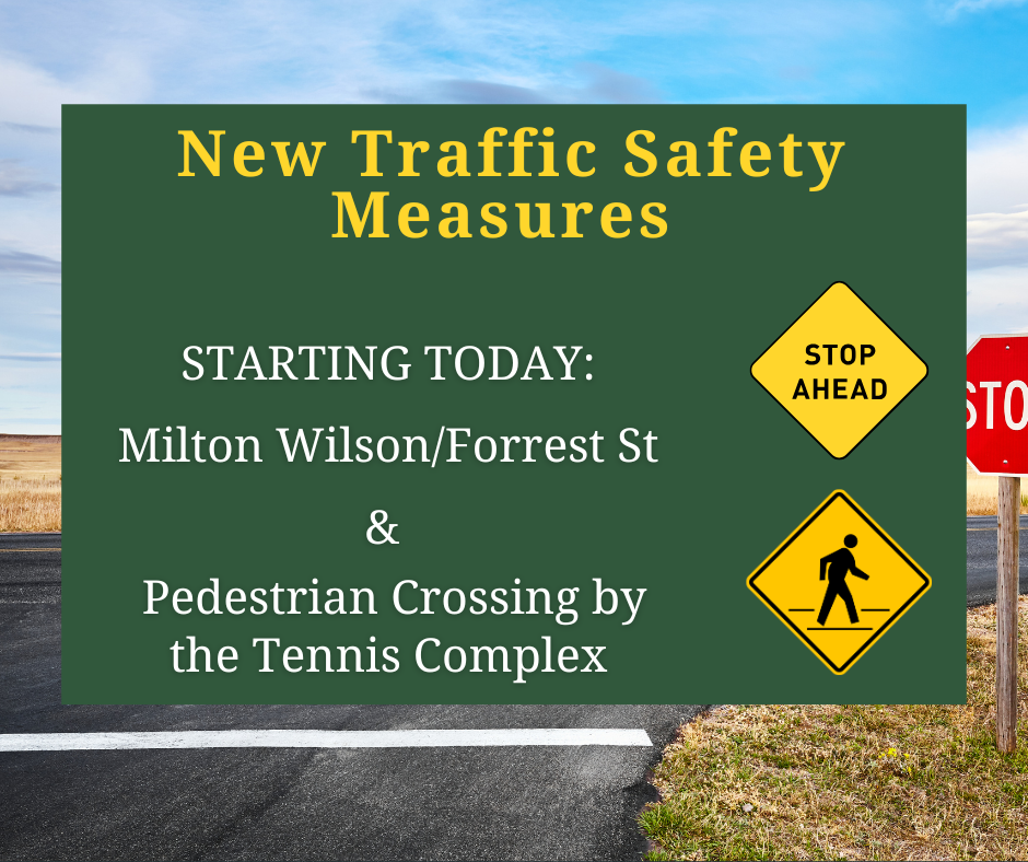 Graphic to alert residents to New Traffic Safety Measures starting today at Milton Wilson and Forrest Street, and at Pedestrian Crossing by the Tennis Complex. Graphic  has road with stop sign in the background and images of yellow stop ahead and pedestrian crossing signs. 