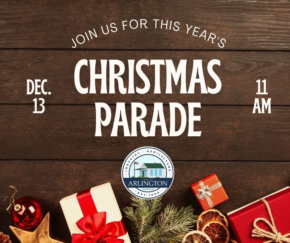 Brown wooden boards with christmas deorations and presents on bottom of screen. Text says: Join us for this year's Christmas Parade - Dec 13 at 11am