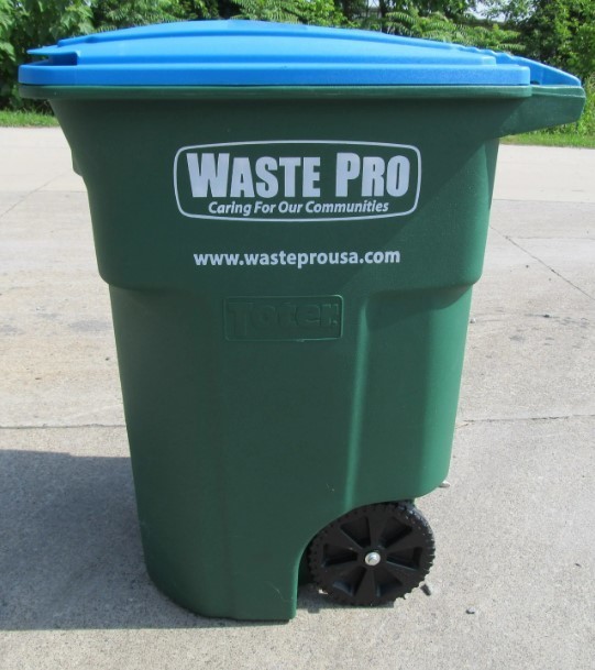 Side view of green WastePro trash bin with blue lid.