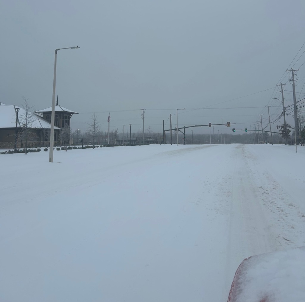 Picture of snow covered Airline Road looking toward traffic signal at Milton Wilson