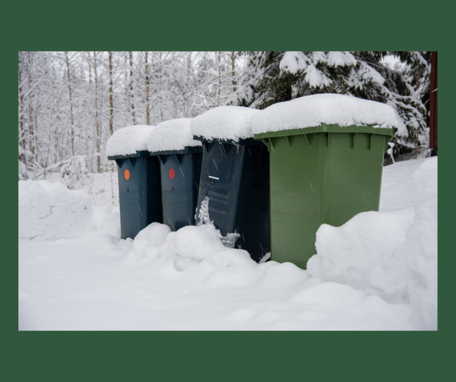 Picture of 4 trash bins out in the snow, with snow covered tops.