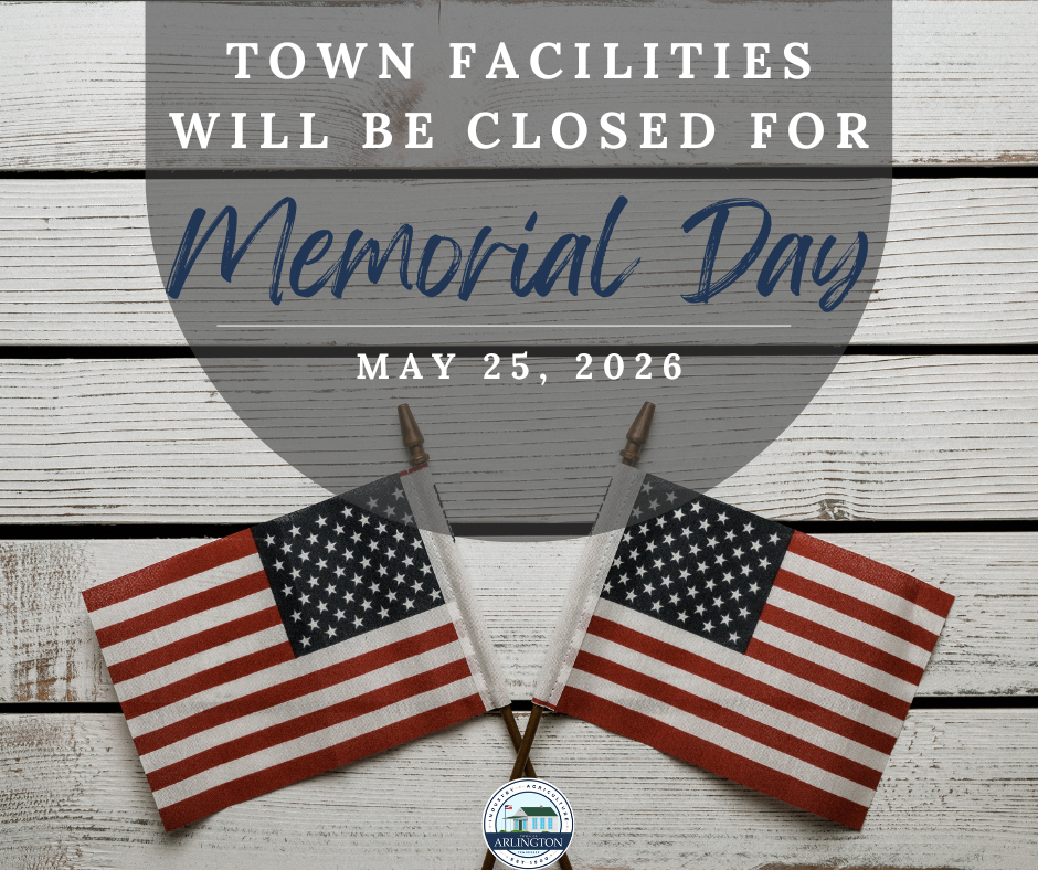 Memorial Day, May 25, 2026, graphic to announce town facilities will be closed. Includes two small us flags laying on a wood floor that is painted white.