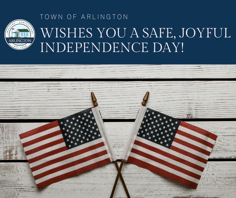 Town of Arlington graphic wishing a safe, joyful Independence Day. Includes two small US flags on a white, wooden background. 