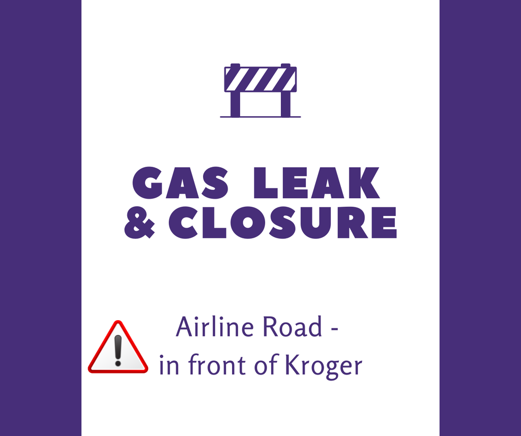 purple and white notification of a gas leak and closure on airline road in front of Kroger