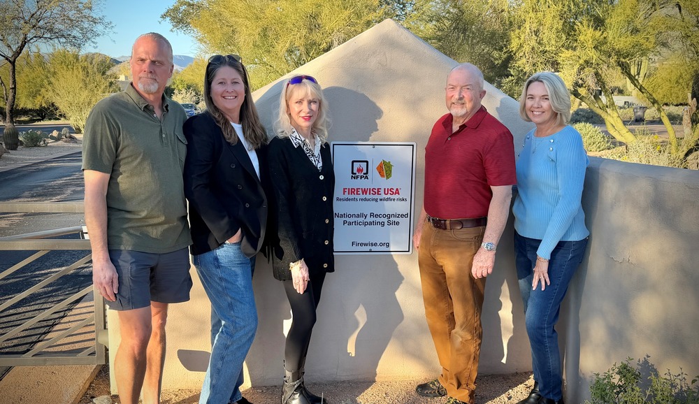 HOA Members in front of new Firewise USA Site Sign