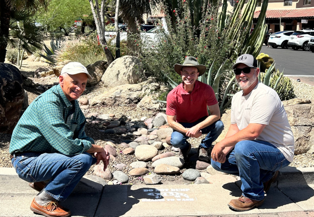 Mayor, Town Engineer and Public Works Supervisor posing with storm drain painting