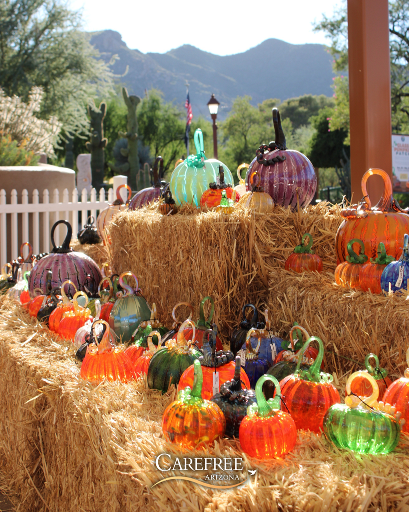 Glass Pumpkins on hay bales with Black Mountain in the background