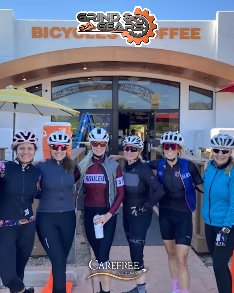 Group of people smiling and ready to bike