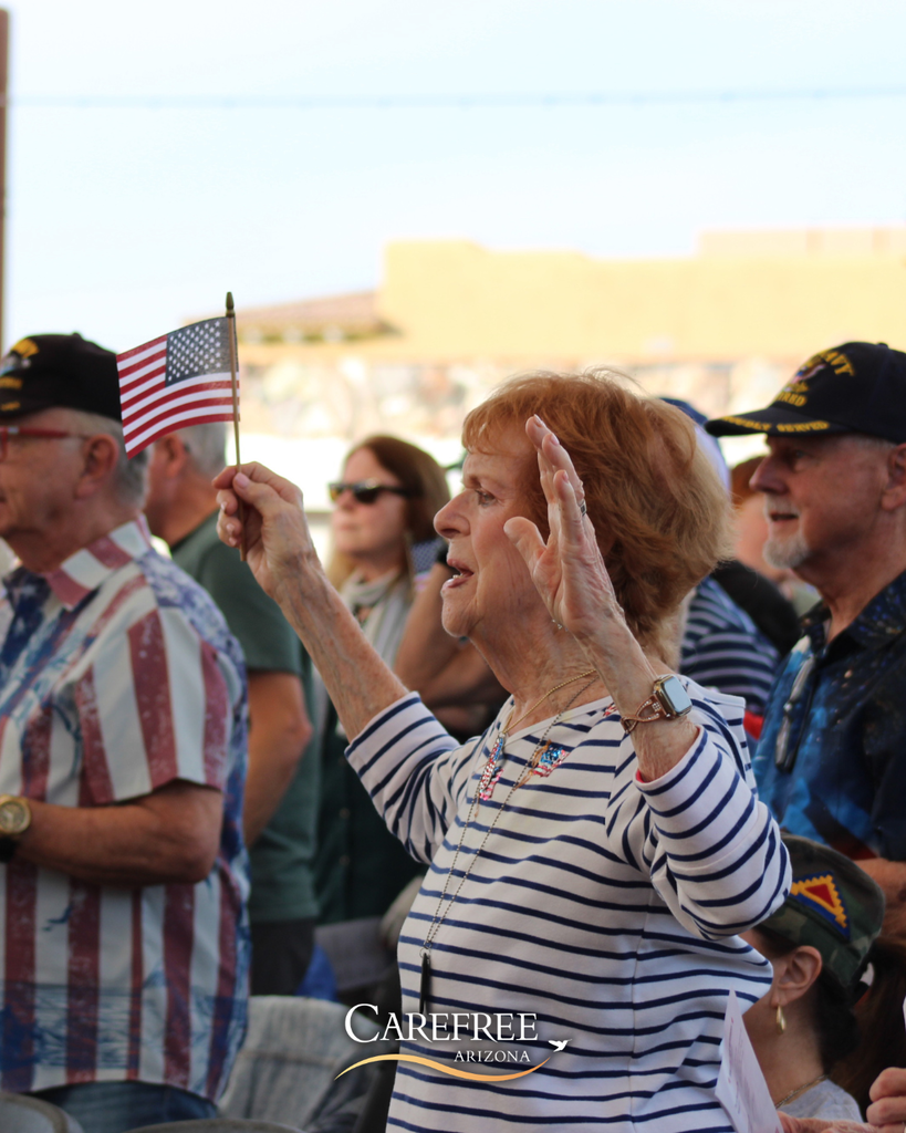 Woman with hands raised singing
