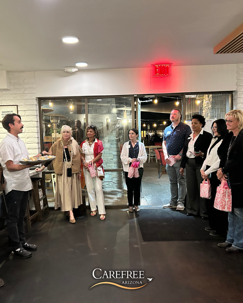 Man speaking to people gathered in a room