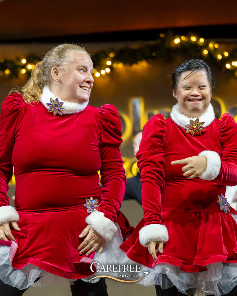 Two young women dancing and smiling