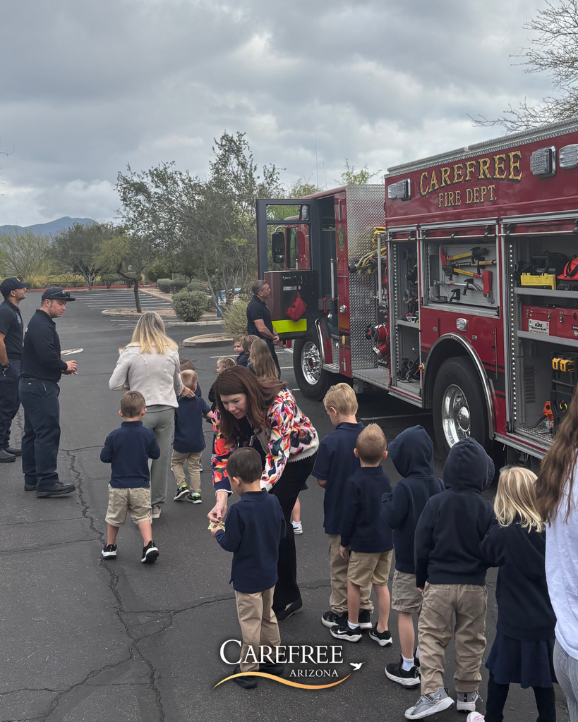 Kids lined up to check out fire truck