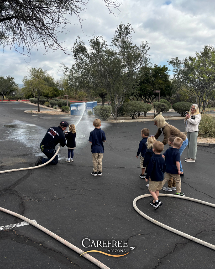 Kids spraying fire hose