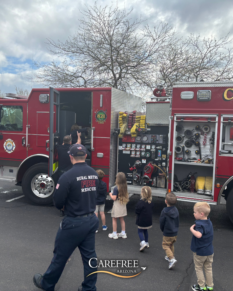 Kids lined up to look at fire truck