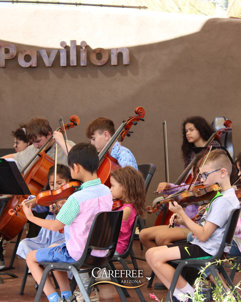 Little kids playing violins