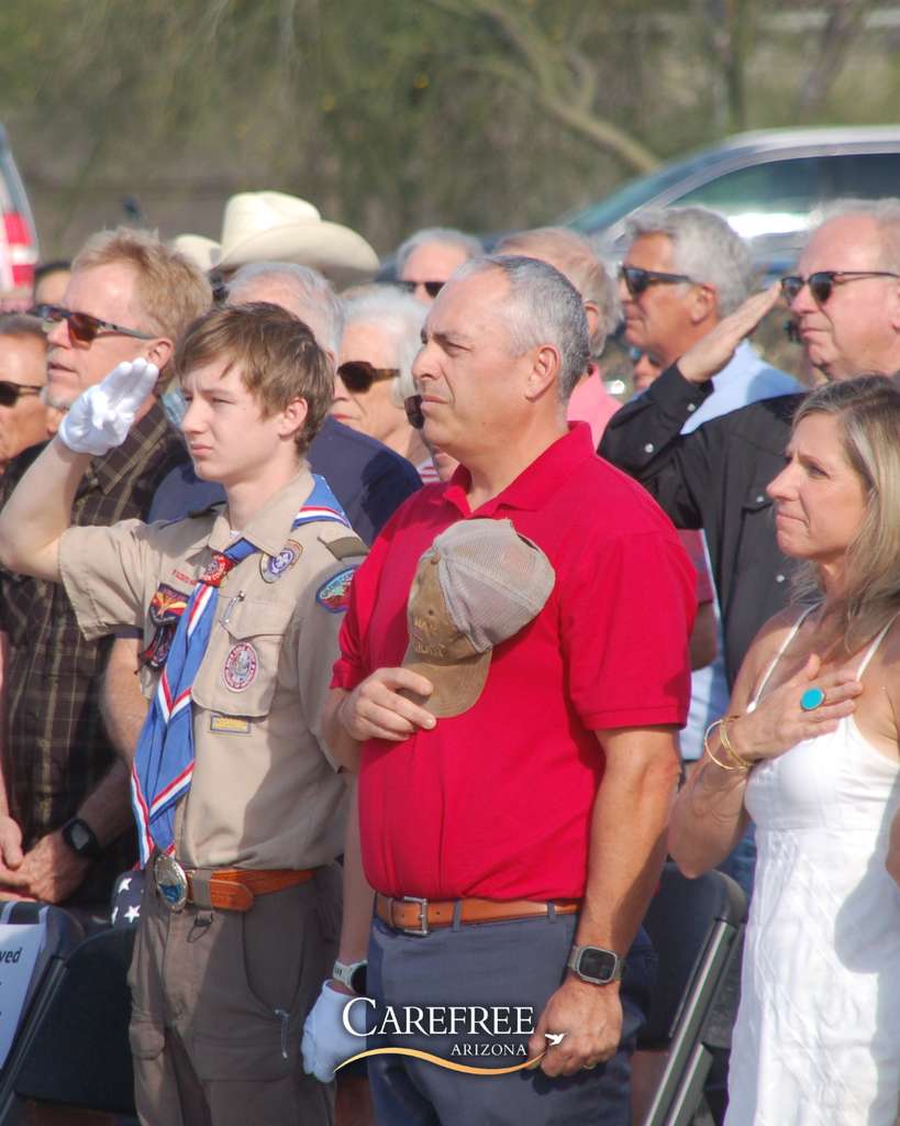 Crowd saluting to flag