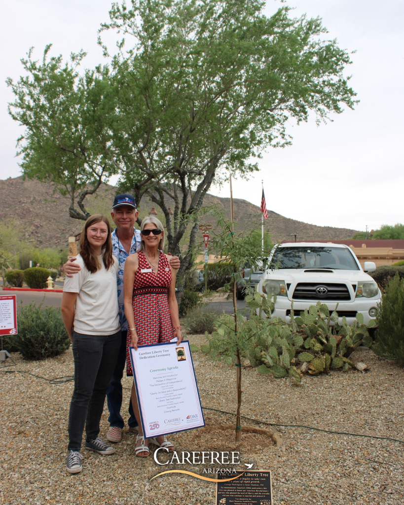Kris Johns and her family posed next to the Carefree Liberty Tree