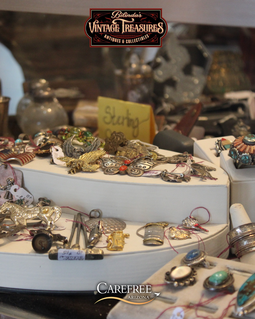 Brooches and jewelry in case