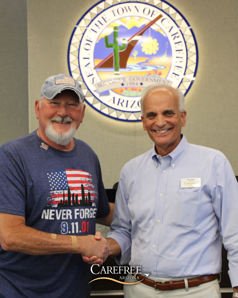 Bob Jenkins and Mayor John Crane shaking hands