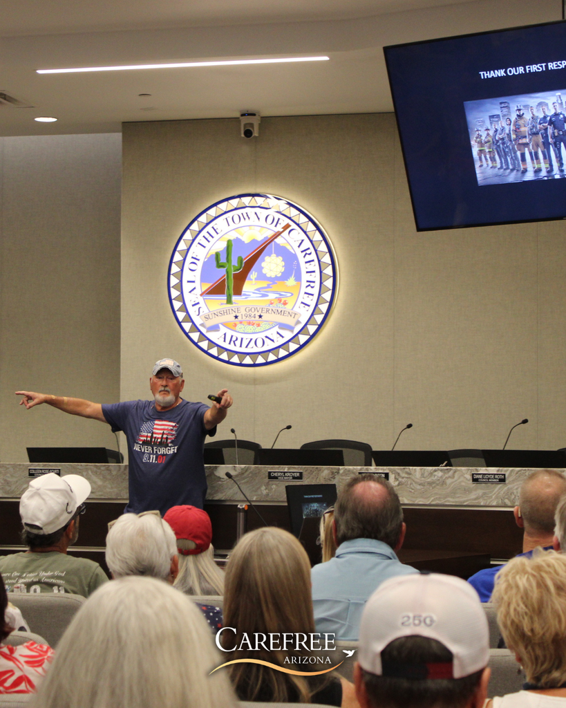 Bob Jenkins pointing into the crowd thanking first responders