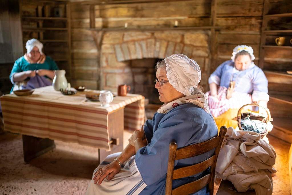 Woman portraying Mary Patton, gun powder maker