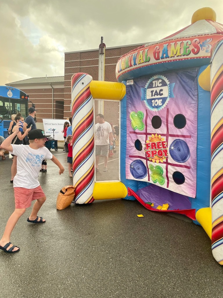 Child playing giant tic-tac-toe at Star Spangled Celebration