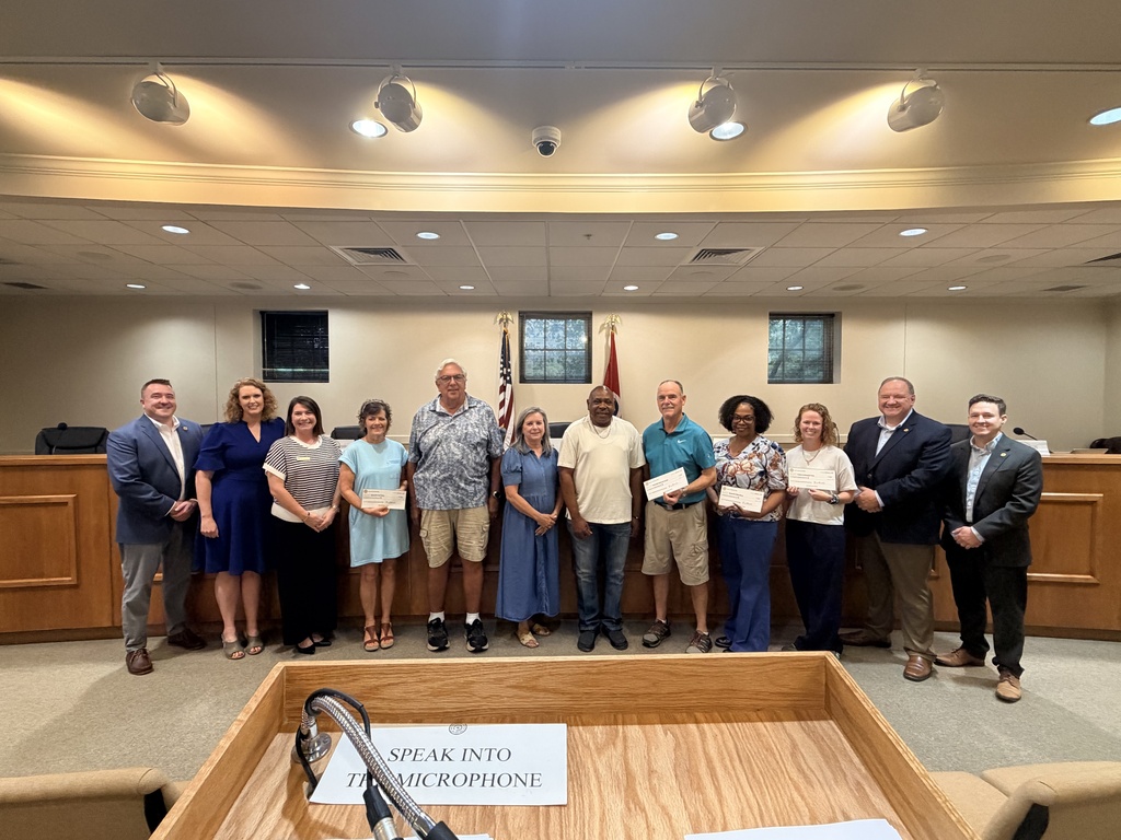 Town of Nolensville Board of Commissioners with representatives of local Nolensville organizations accepting a check donation from the Historic Nolensville Buttercup Festival Committee