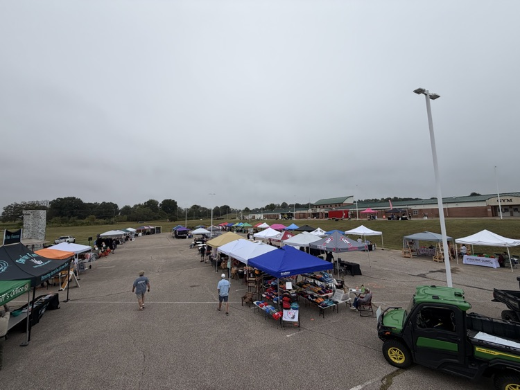 a photo of vender booths set up in a parking lot 