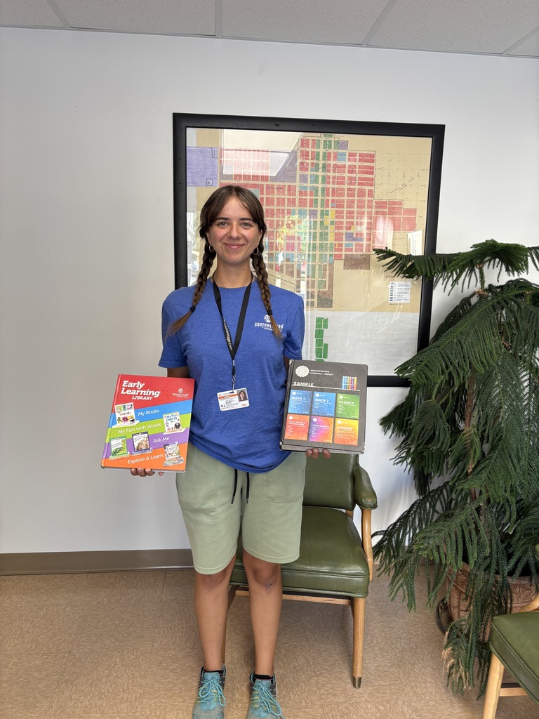 Laura Rebeka Vaivade from Lativia, Europe -  Town of Springfield her Peddler and Itinerant Merchants License holder here until August 22, 2025 holding the books she is selling around town trying to fund her college education.