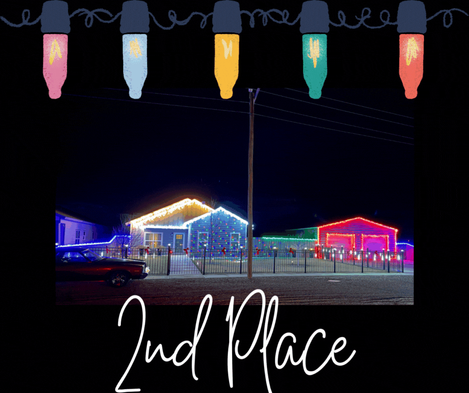 Nighttime photo of a house decorated with Christmas lights. Colorful illustrated Christmas light bulbs frame the top of the image. The words ‘2nd Place’ appear in white script at the bottom, indicating the display won second place.