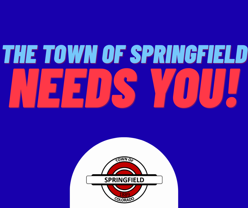 Bold graphic with a blue background reading “THE TOWN OF SPRINGFIELD NEEDS YOU!” in large, high-contrast lettering. Below the text is the Town of Springfield, Colorado seal featuring red, white, and black elements and the year 1889.
