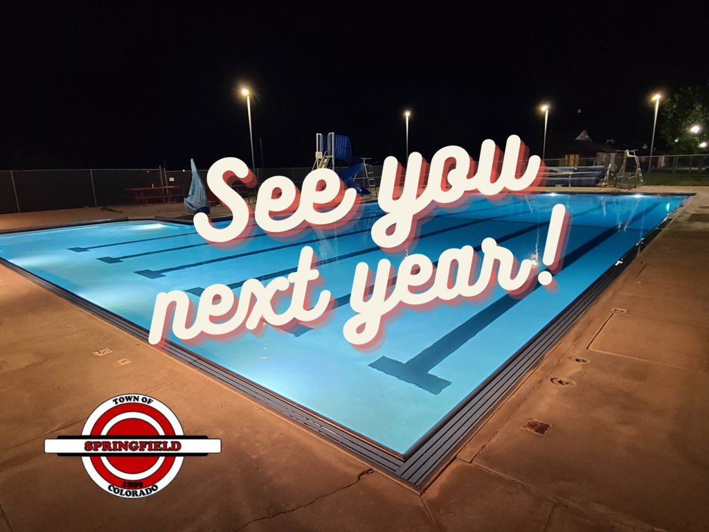 Picture of the Springfield Swimming Pool at night, with the words "See you next year!" over the top. Featuring the town logo in the bottom left corner.