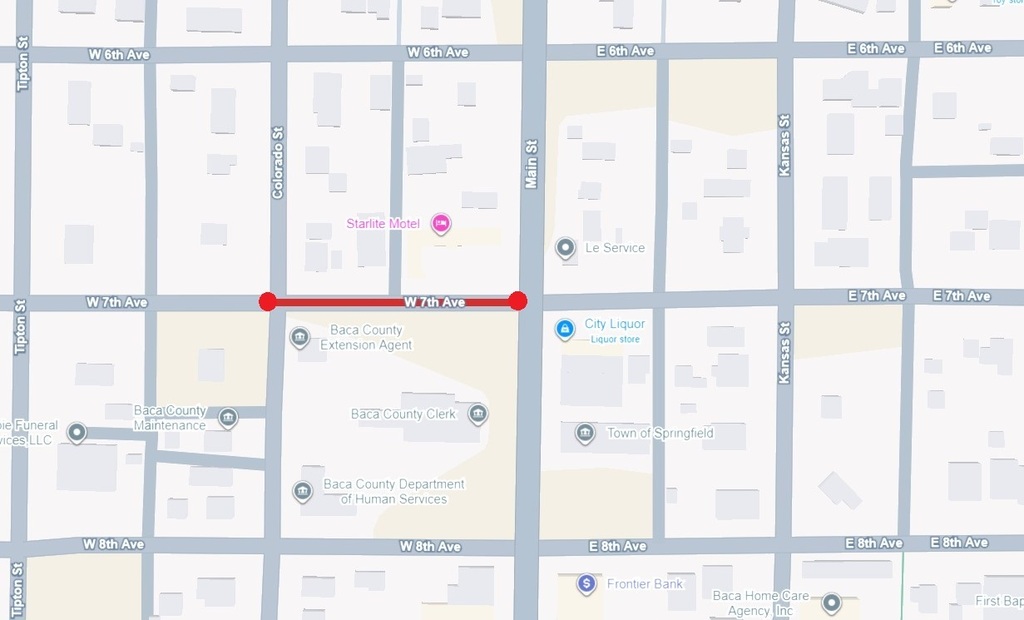 Map of downtown Springfield highlighting a road closure on West 7th Avenue. A red line with red dots at each end marks the closed section between Colorado Street and Main Street. Nearby landmarks include the Baca County Extension Agent, Baca County Clerk, Baca County Department of Human Services, City Liquor, the Town of Springfield offices, Frontier Bank, and the Starlite Motel.
