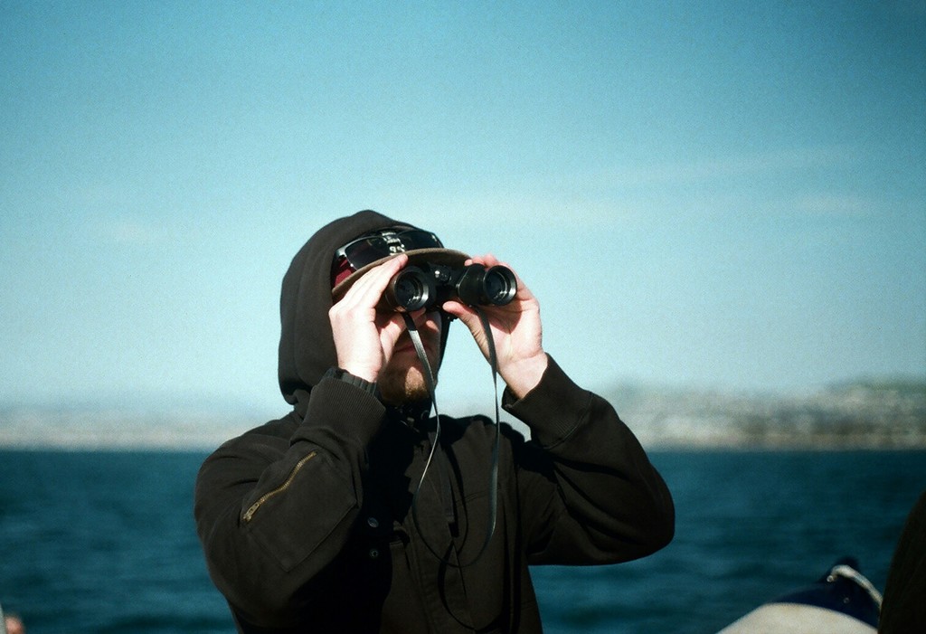 Man Looking with Binoculars
